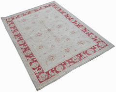 An Afghan Chobi rug featuring a cream field with red floral motifs and a matching red border.