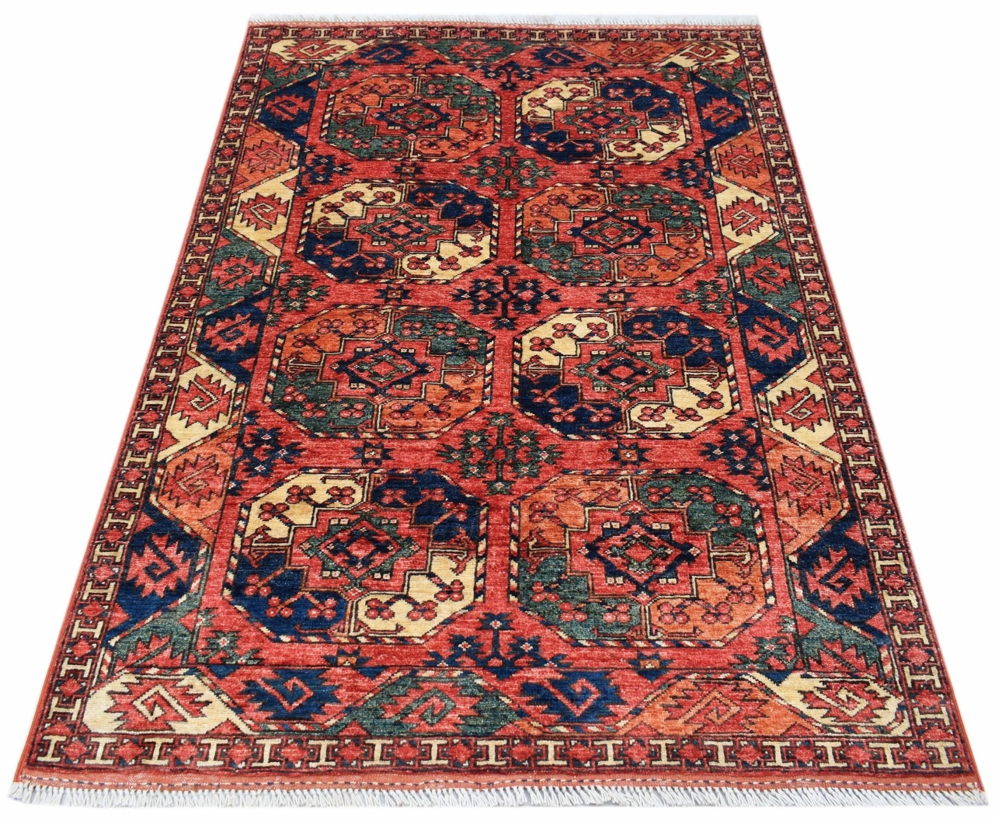 Handwoven Afghan Chobi rug featuring a geometric pattern in red, blue, and cream wool.
