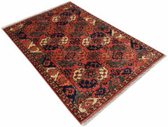 A rectangular Afghan Chobi rug featuring a traditional geometric pattern in red, blue, and cream.