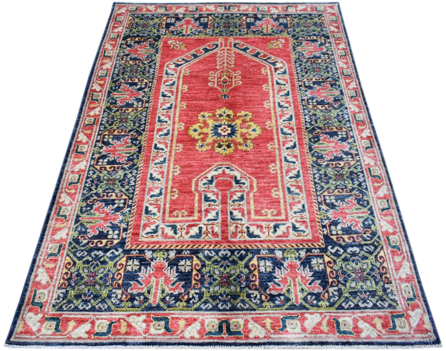 A rectangular Afghan Chobi rug featuring a traditional red mihrab design with blue floral borders.