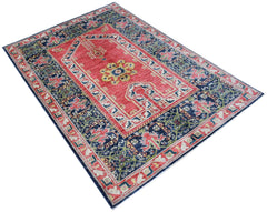 A rectangular Afghan Chobi rug featuring a red central mihrab design with blue floral borders.