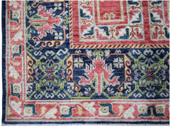 A handwoven Afghan Chobi rug featuring a traditional geometric pattern in red, blue, and cream.