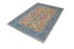 A rectangular Afghan Chobi rug featuring a traditional floral pattern in blue, red, and beige.