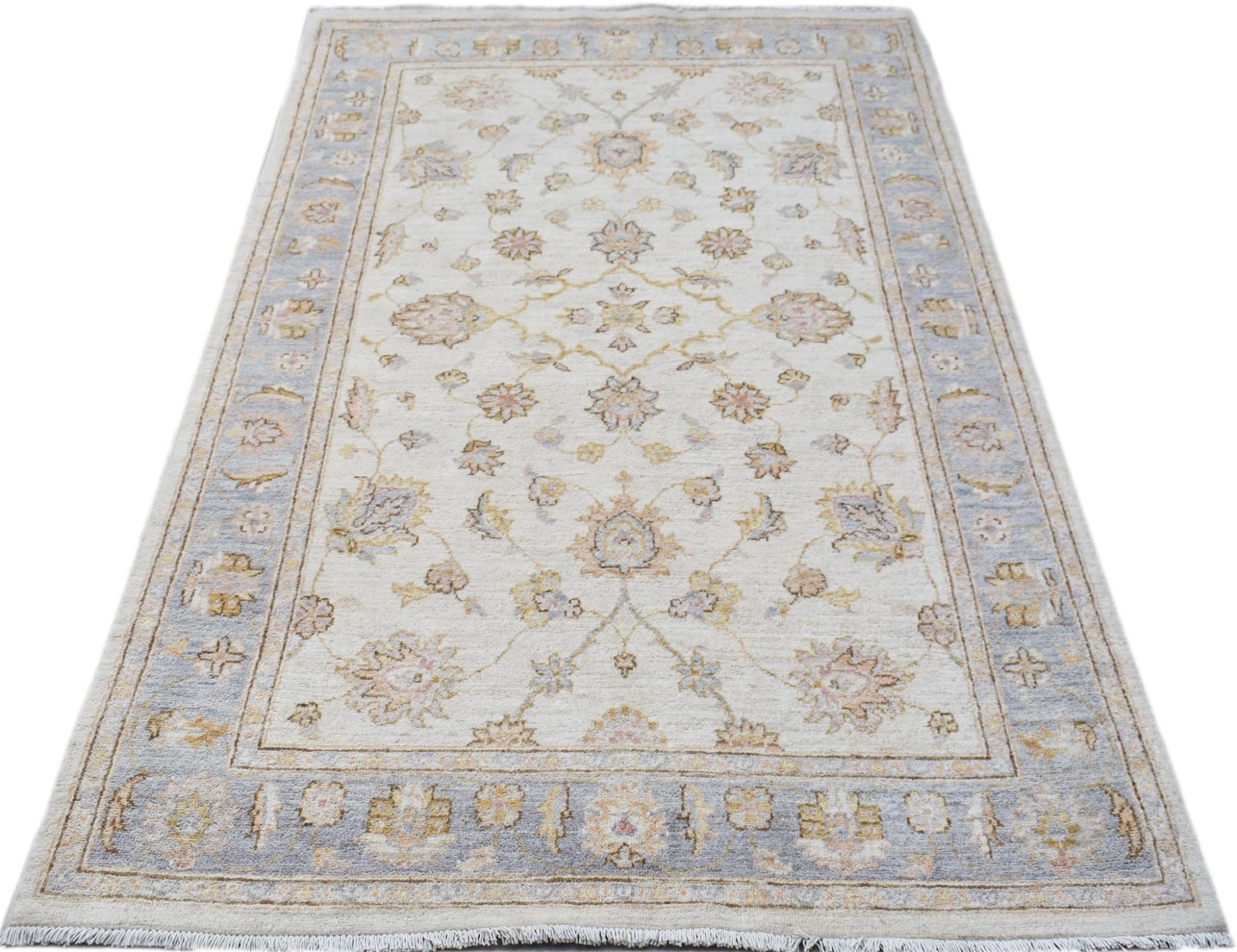 A rectangular Afghan Chobi rug featuring a traditional floral pattern in soft blue and beige tones.
