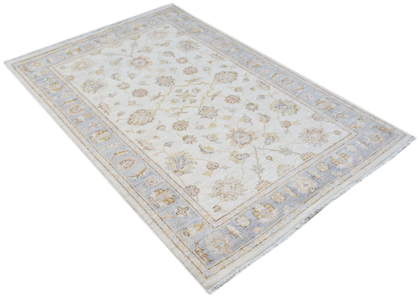 An Afghan Chobi rug featuring a traditional floral pattern in soft beige and blue tones.