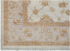 A handmade Afghan Chobi rug featuring a traditional floral pattern in soft beige and brown tones.