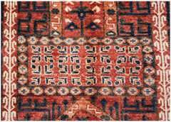 A handmade Afghan Chobi rug featuring intricate geometric patterns in shades of red and blue.