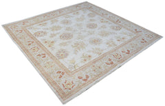 A square Afghan Chobi rug featuring a traditional floral pattern in soft, earthy tones.