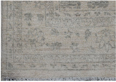 A handwoven Afghan Chobi rug featuring a traditional pattern in soft beige and grey tones.