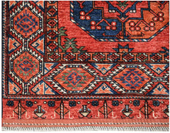 A handmade Afghan Chobi rug featuring traditional geometric patterns in red, blue, and orange.
