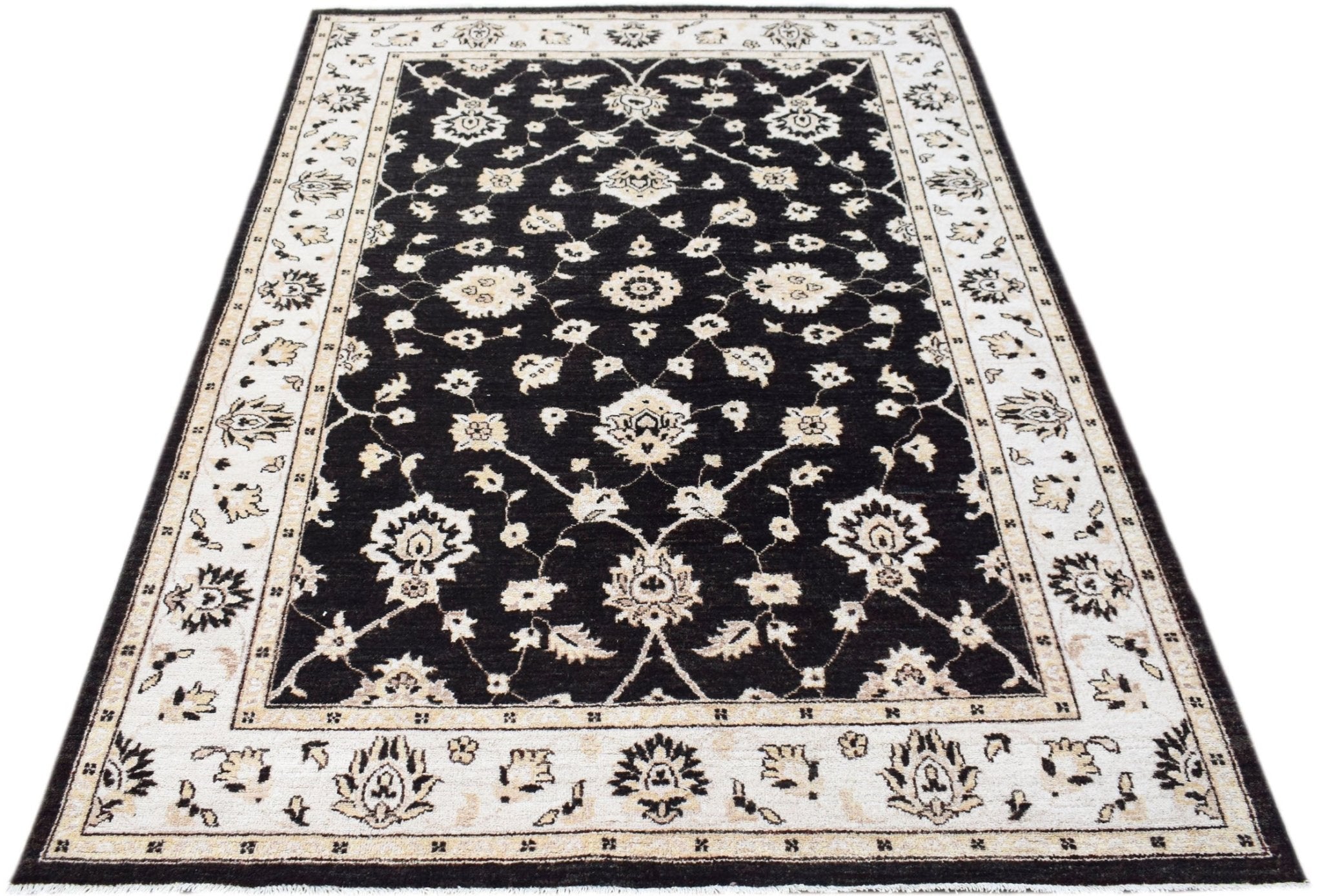 A rectangular Afghan Chobi rug featuring a black field with intricate cream floral patterns.