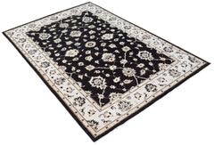 A rectangular Afghan Chobi rug featuring a black field with intricate cream floral patterns.