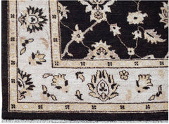 A handmade Afghan Chobi rug featuring a dark brown field with cream floral patterns and borders.