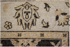 A close-up of a handwoven Afghan Chobi rug featuring traditional geometric and floral motifs.