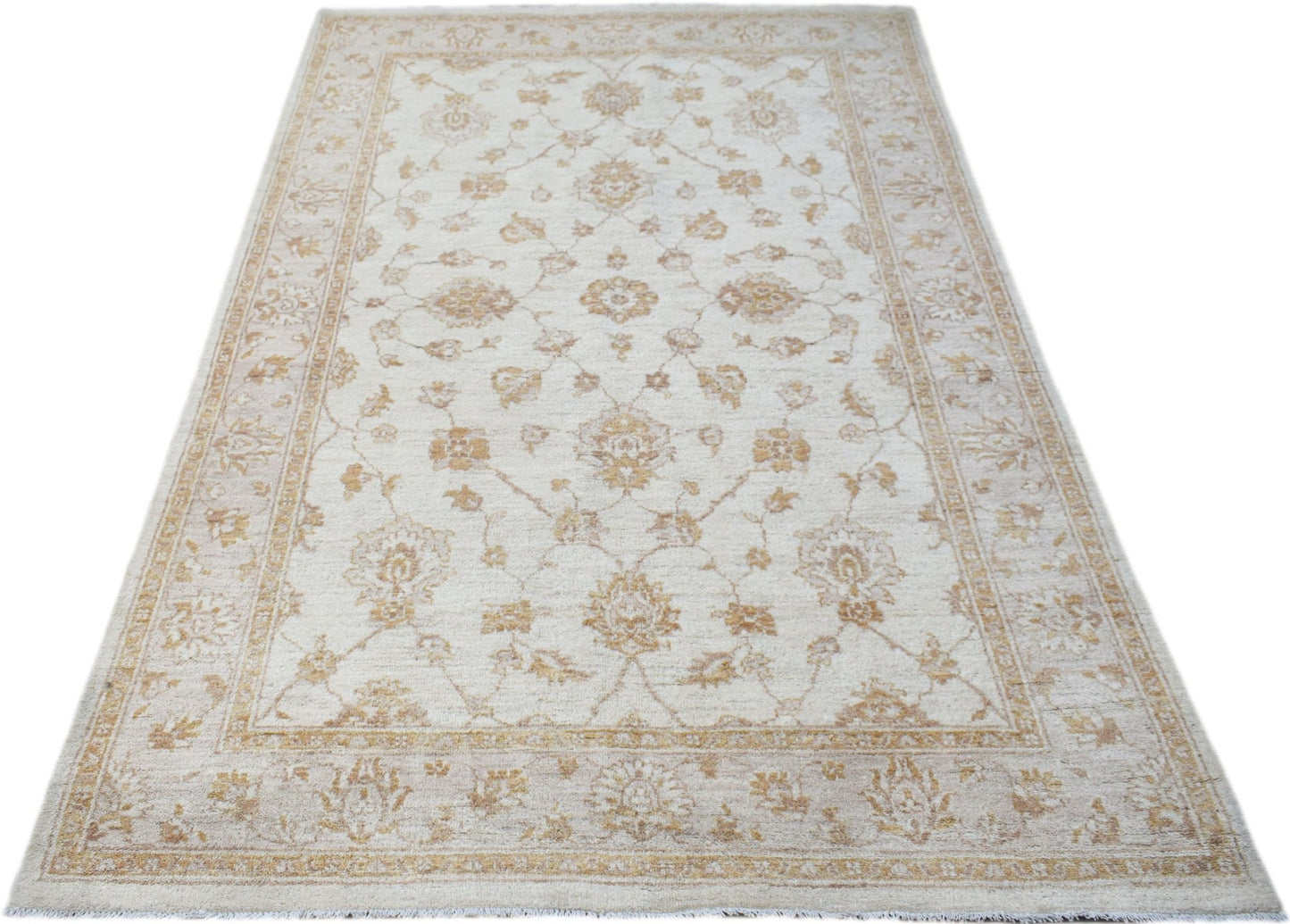 An Afghan Chobi rug featuring a traditional floral pattern in soft beige and golden wood tones.