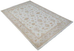 An Afghan Chobi rug featuring a traditional floral pattern in soft beige and tan tones.