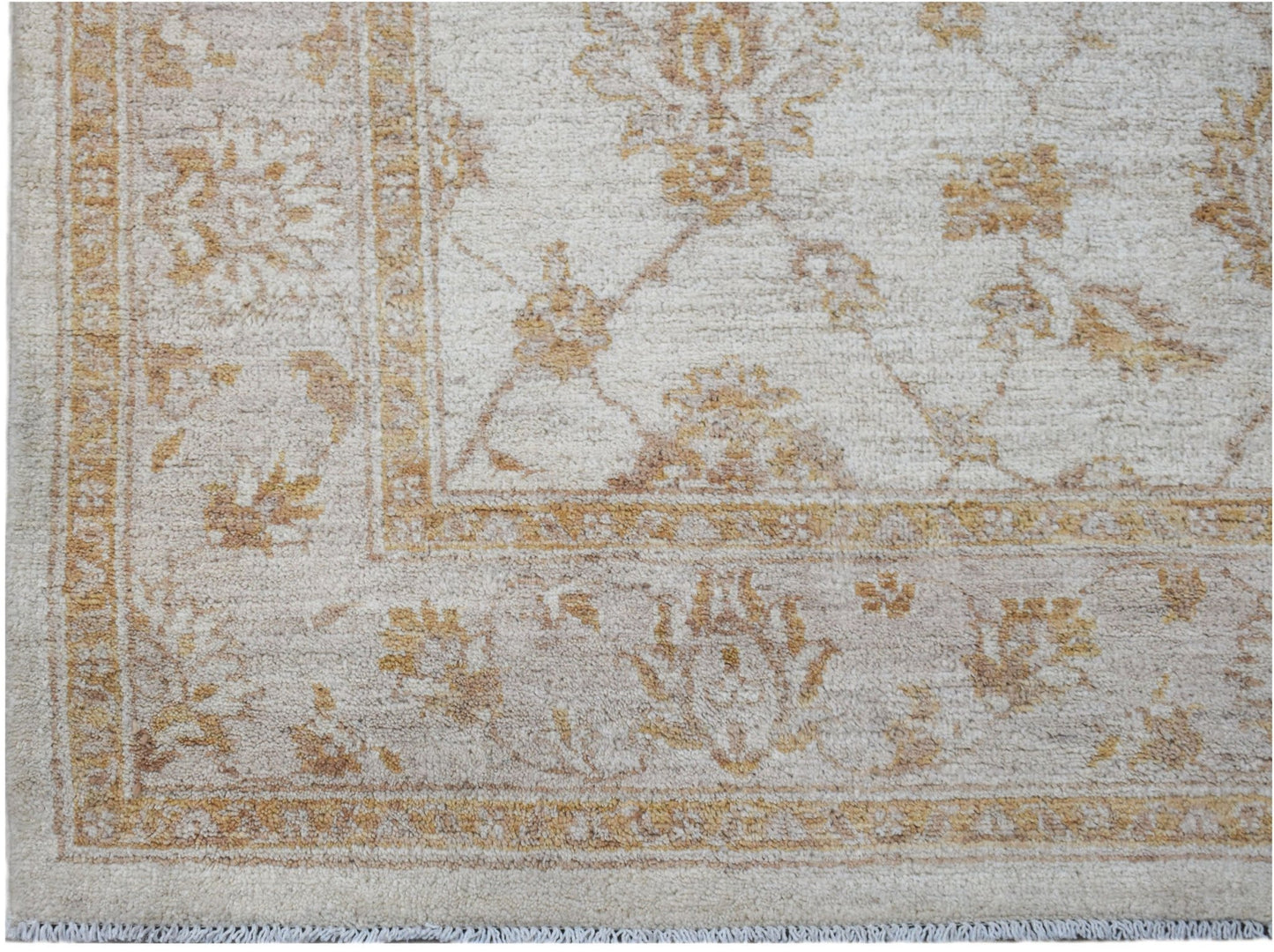Handwoven Afghan Chobi rug featuring a traditional floral pattern in soft beige and wood tones.