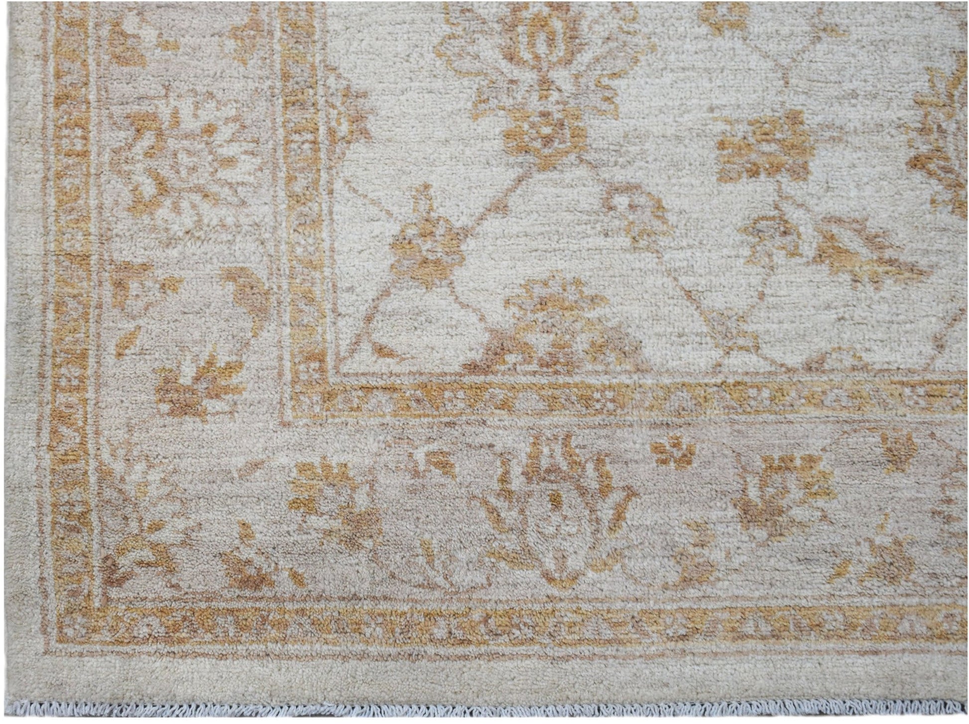Handwoven Afghan Chobi rug featuring a traditional floral pattern in soft beige and wood tones.