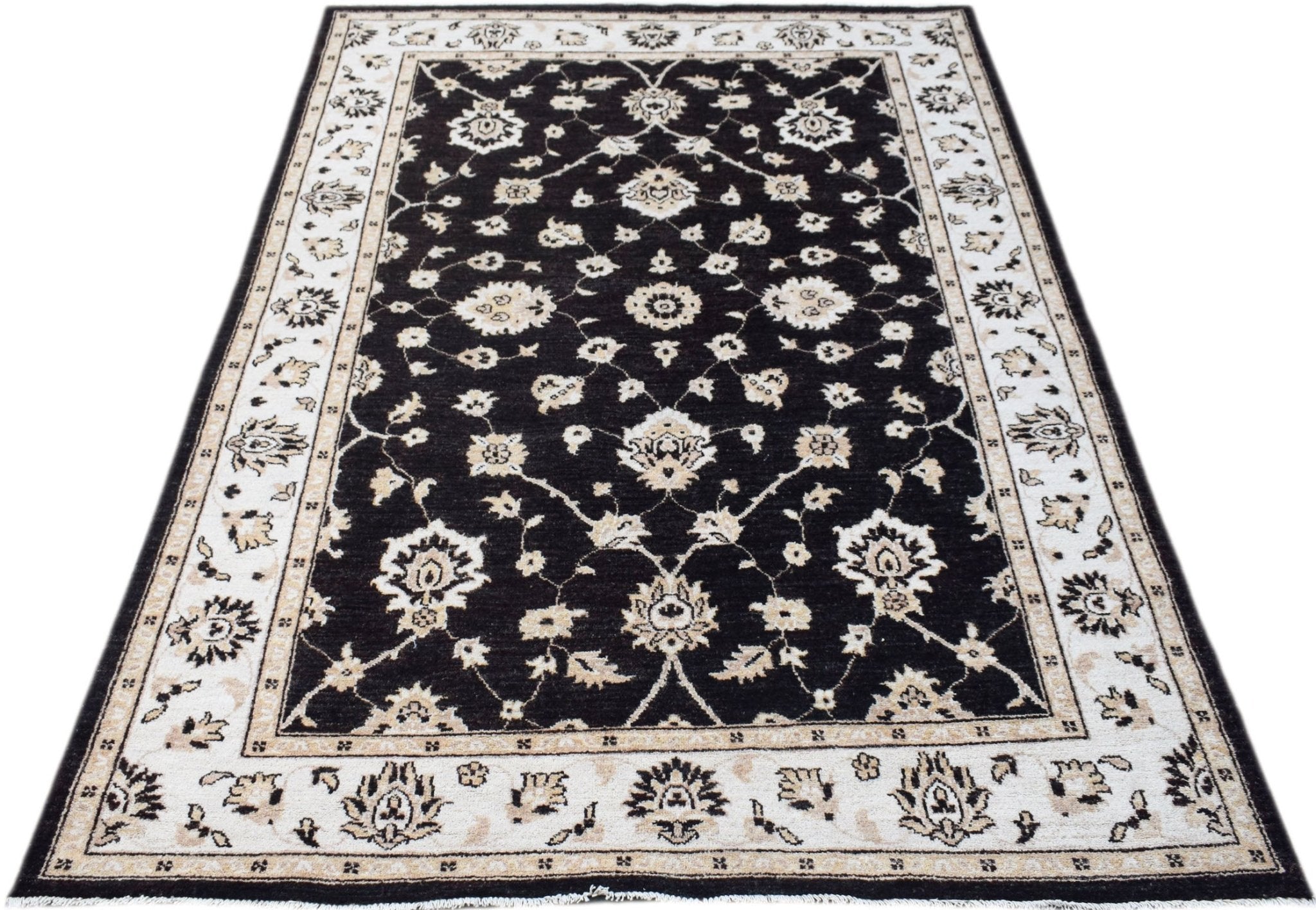 A rectangular Afghan Chobi rug featuring a black field with intricate cream floral patterns.