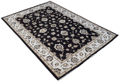 A rectangular Afghan Chobi rug featuring a dark brown field with intricate cream floral patterns.