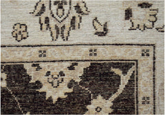 A close-up of a handwoven Afghan Chobi rug featuring traditional dark brown floral motifs.