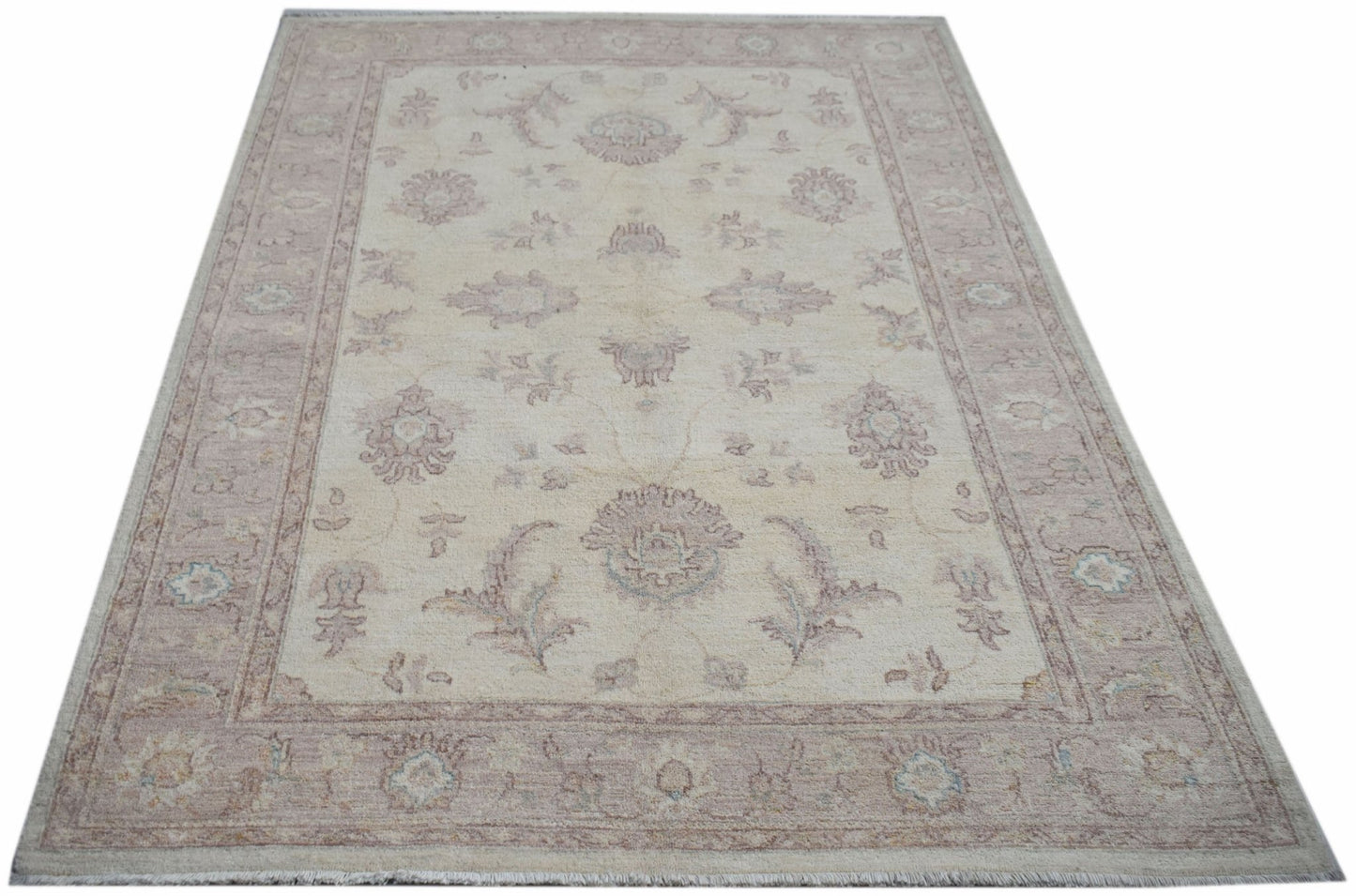 A rectangular Afghan Chobi rug featuring a traditional floral pattern in soft beige and muted tones.