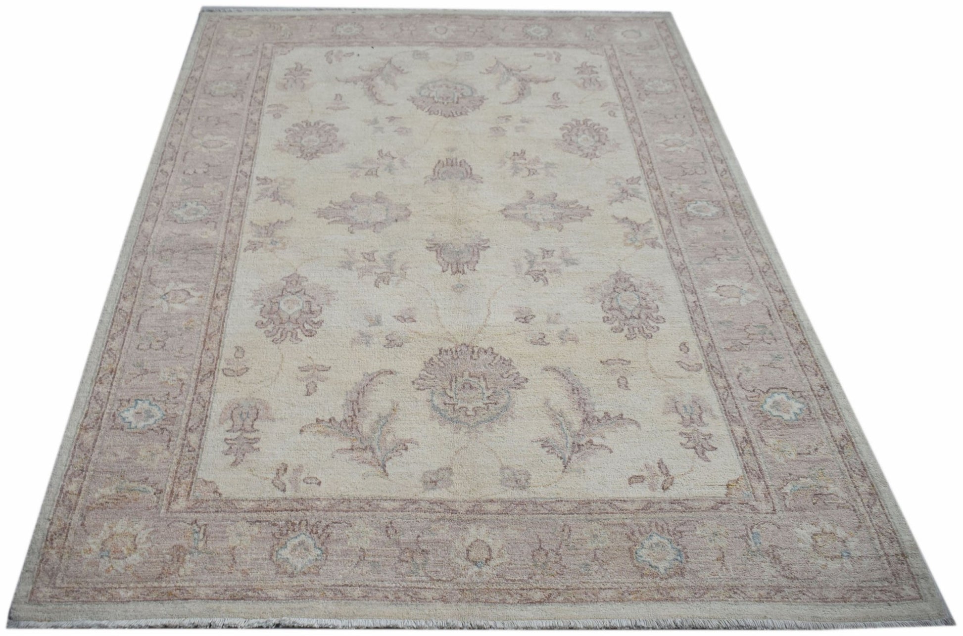 A rectangular Afghan Chobi rug featuring a traditional floral pattern in soft beige and muted tones.