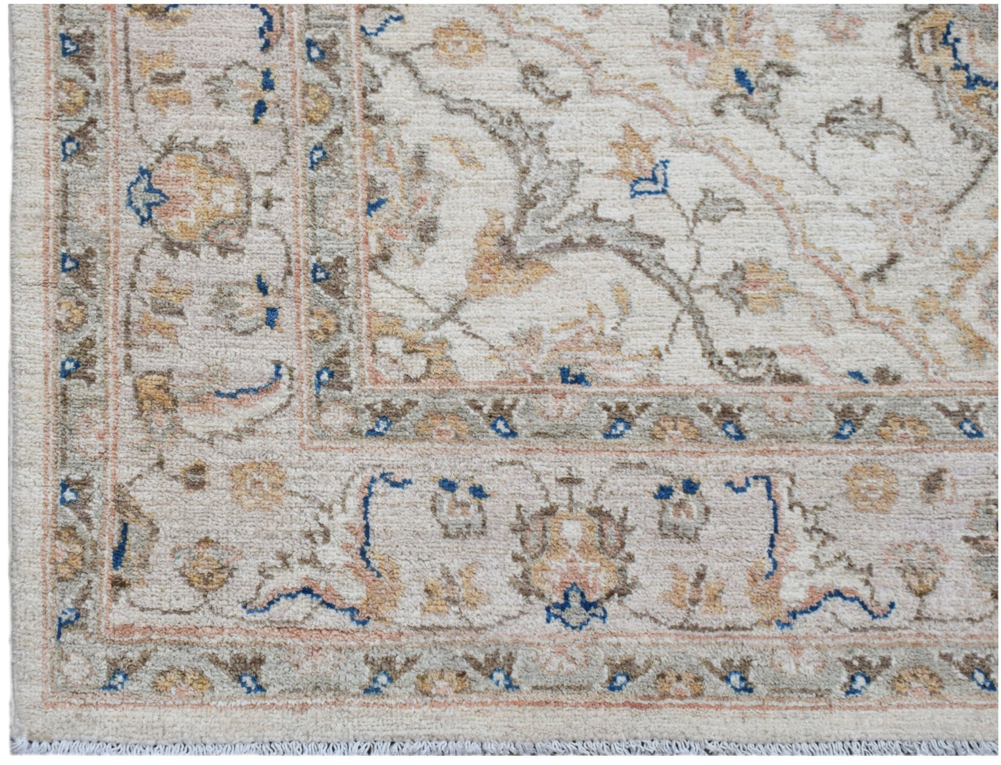 A handwoven Afghan Chobi rug featuring a traditional floral pattern in soft, earthy tones.