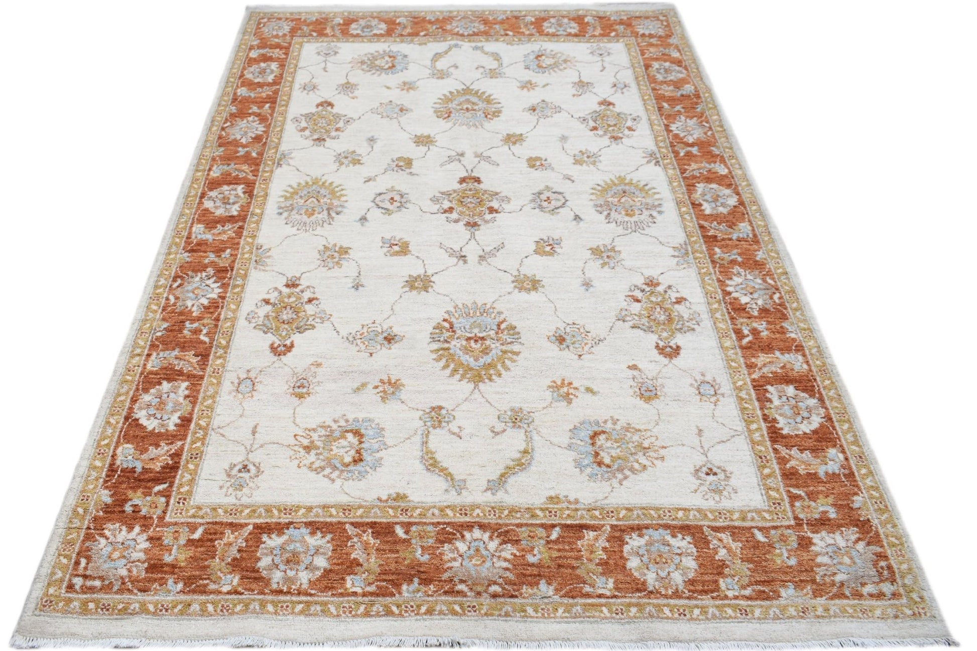 An Afghan Chobi rug featuring a traditional floral pattern in rust and cream tones.