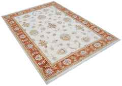 An Afghan Chobi rug featuring a cream field with floral motifs and a wide orange border.