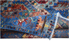 A handwoven Afghan Chobi rug featuring intricate geometric patterns in blue, red, and gold tones.