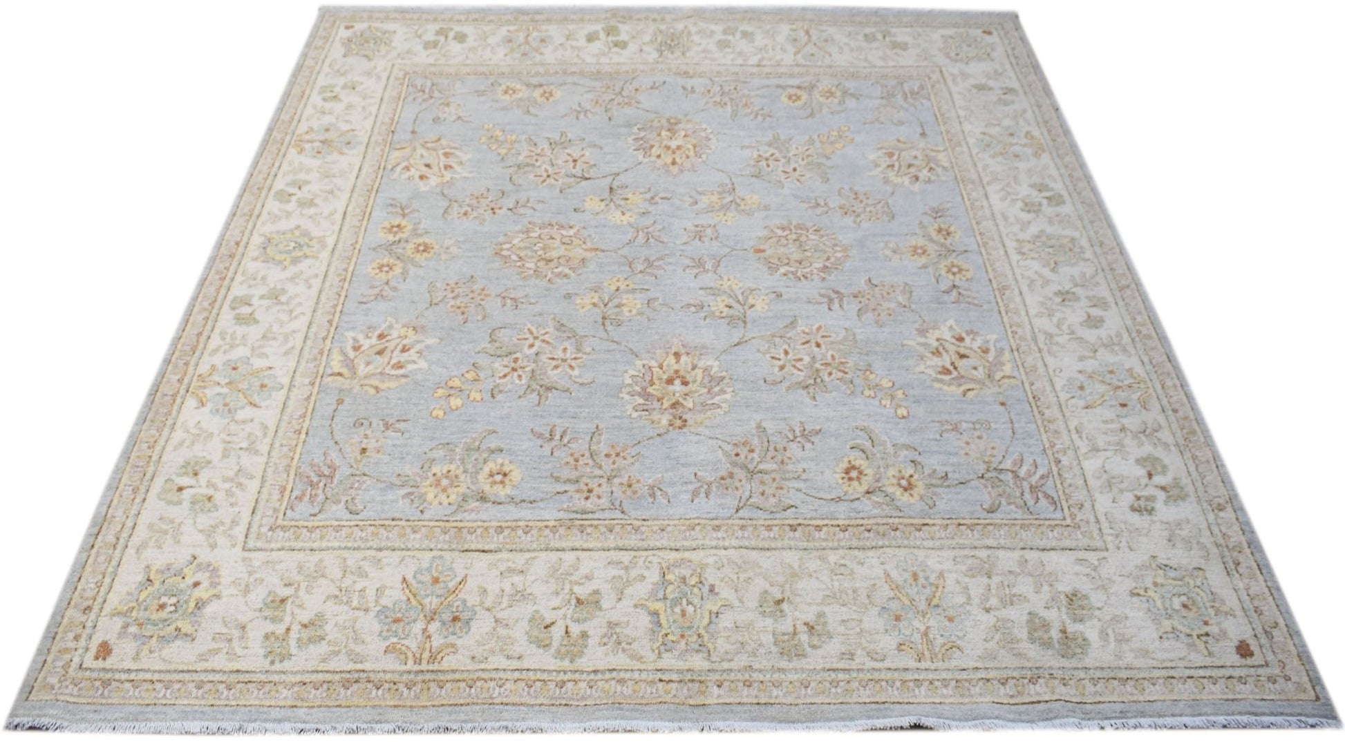 A square Afghan Chobi rug featuring a light blue field with a traditional floral pattern.