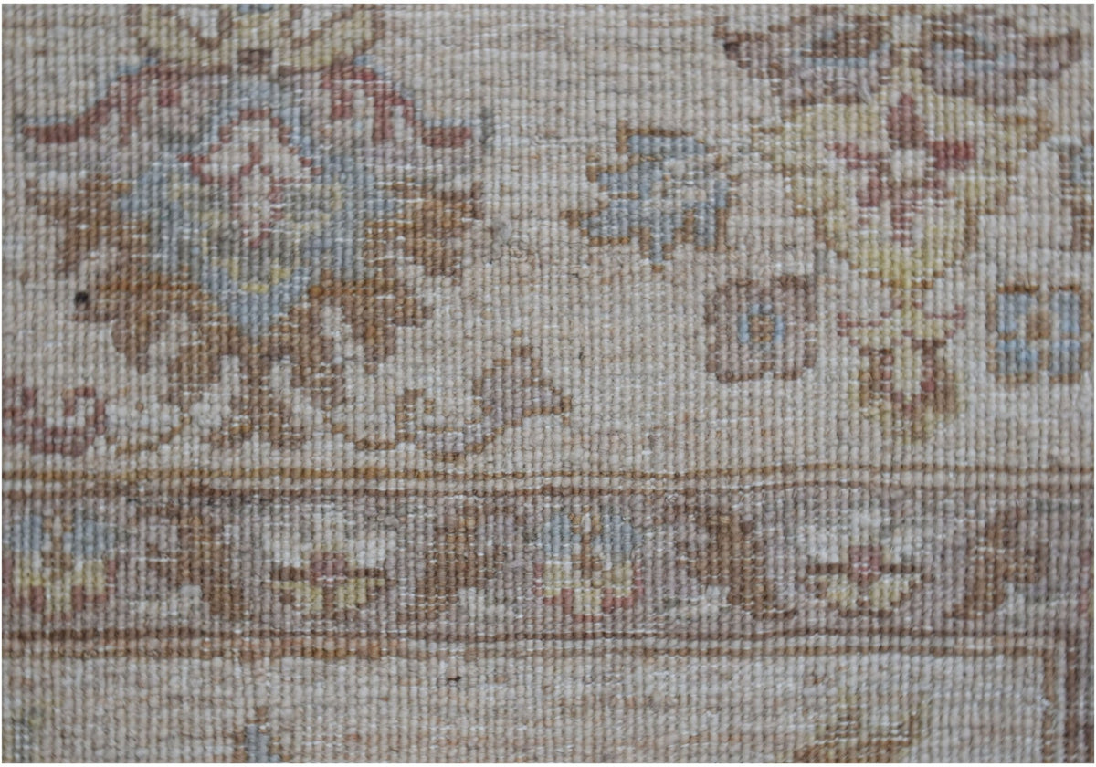 A close-up of a handwoven Afghan Chobi rug featuring traditional floral patterns in earthy tones.