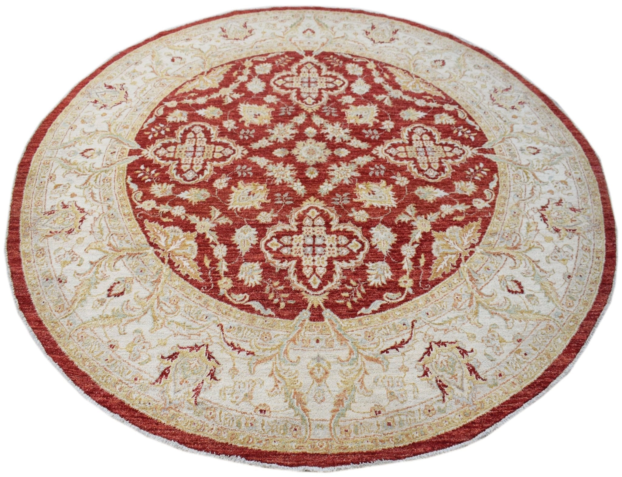 A round Afghan Chobi rug featuring a red central medallion with intricate floral patterns.