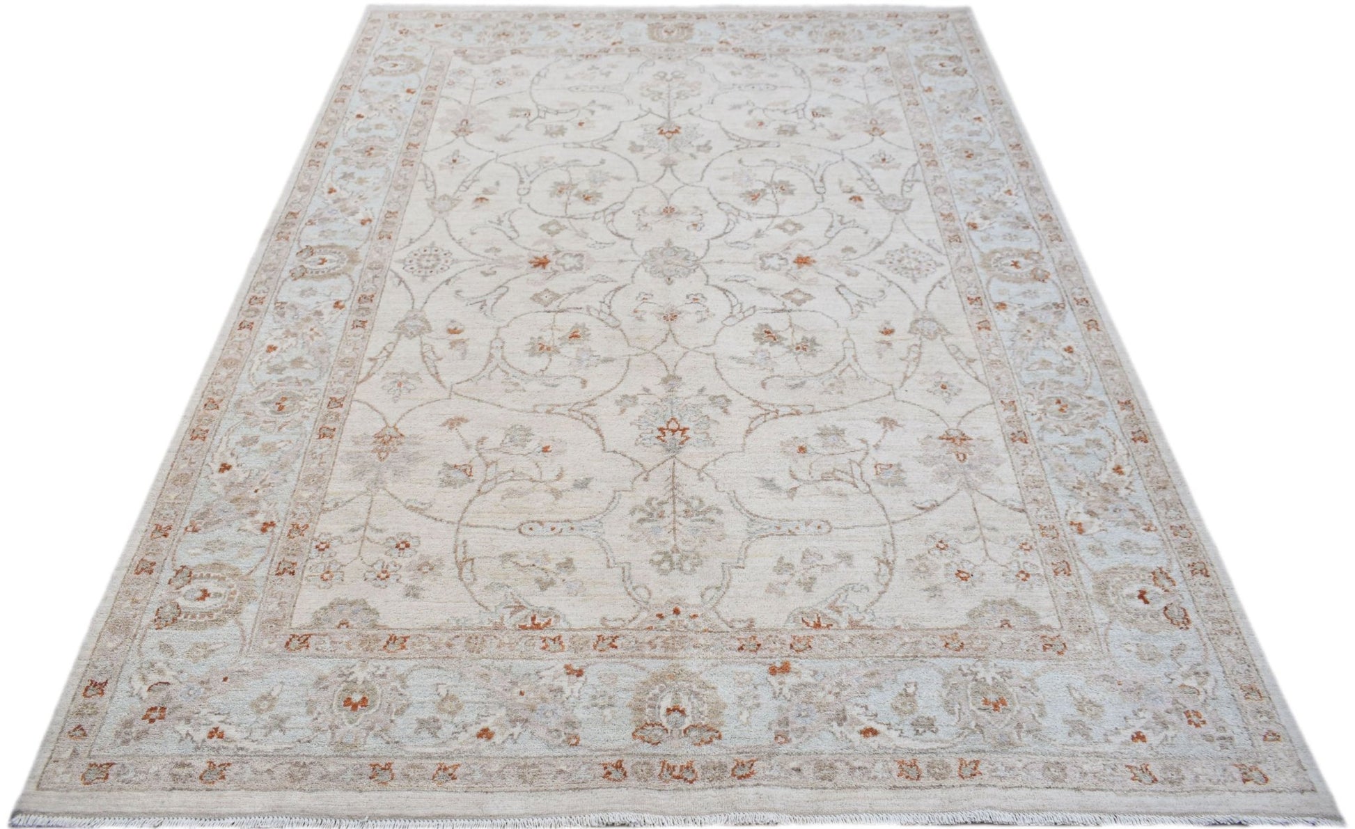 A handmade Afghan Chobi rug featuring a traditional floral pattern in soft beige and rust tones.