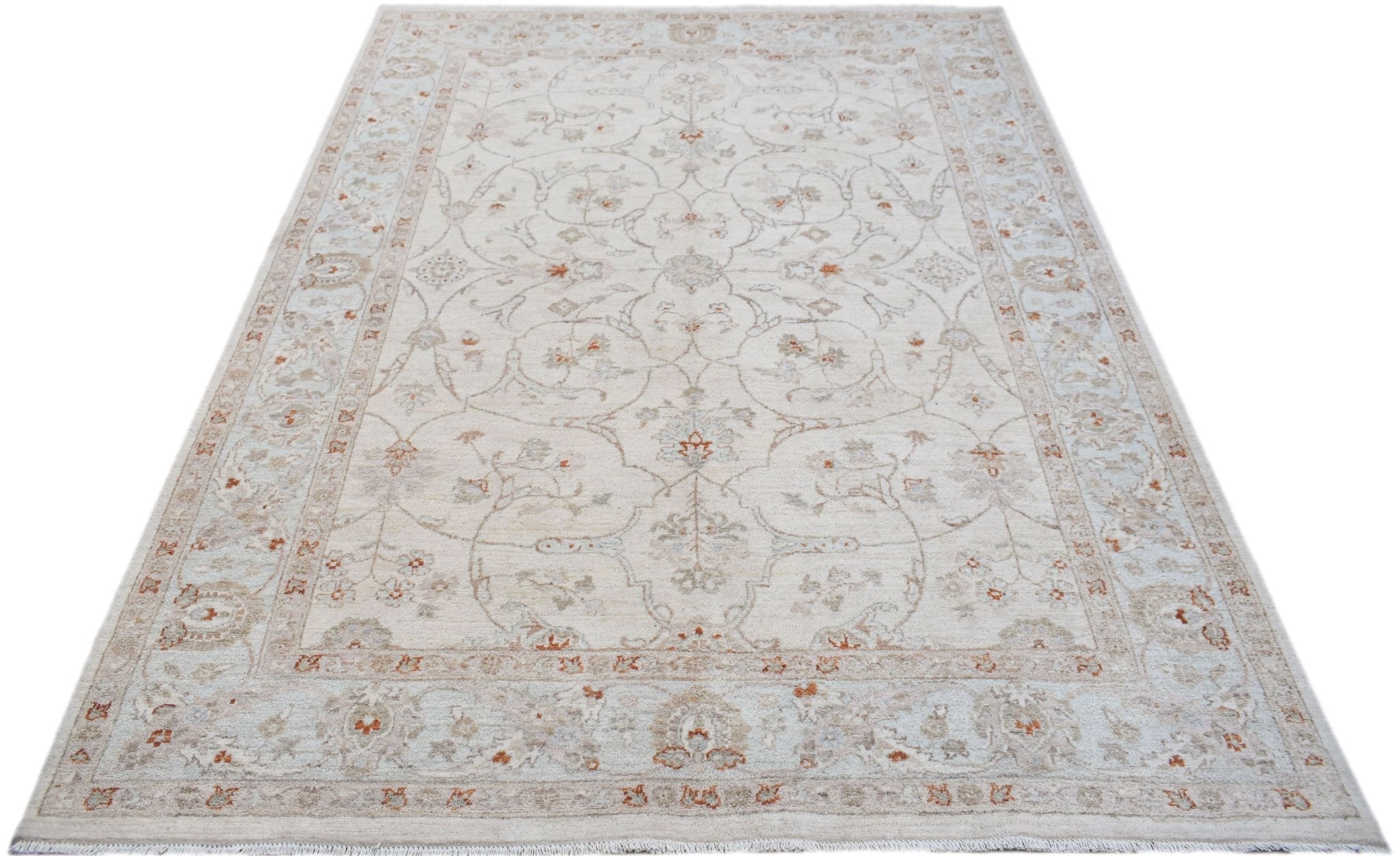 A handmade Afghan Chobi rug featuring a traditional floral pattern in soft beige and rust tones.