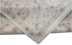A handwoven Afghan Chobi rug featuring a traditional floral pattern in soft beige and orange tones.
