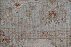 A close-up of a handwoven Afghan Chobi rug featuring traditional patterns in soft, earthy tones.