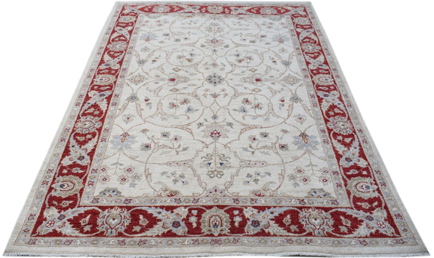 A rectangular Afghan Chobi rug featuring a cream field with floral patterns and a red border.