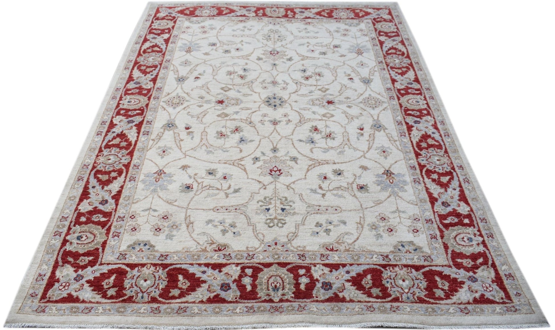 A rectangular Afghan Chobi rug featuring a cream field with floral patterns and a red border.