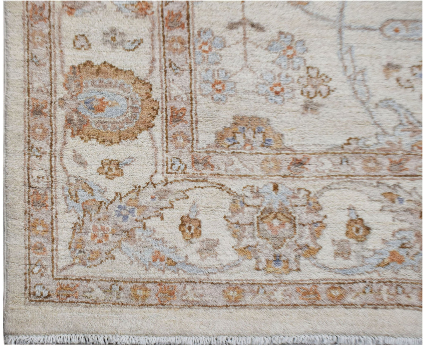 An Afghan Chobi rug featuring traditional floral patterns in soft wood tones on a cream background.
