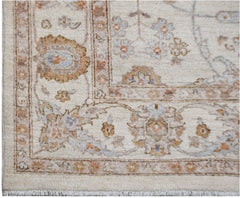 An Afghan Chobi rug featuring traditional floral patterns in soft wood tones on a cream background.
