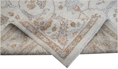 A handwoven Afghan Chobi rug featuring a traditional floral pattern in soft, earthy tones.