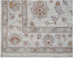 A handmade Afghan Chobi rug featuring a traditional floral pattern in soft, earthy wood tones.