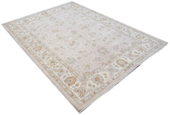 An Afghan Chobi rug featuring a traditional floral pattern in soft beige and earthy tones.