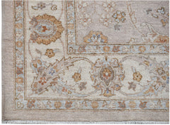 A handmade Afghan Chobi rug featuring a traditional floral pattern in soft, earthy wood tones.