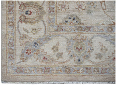 A handmade Afghan Chobi rug featuring a traditional floral pattern in soft, earthy tones.