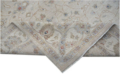 A handwoven Afghan Chobi rug featuring a traditional floral pattern in soft, earthy tones.