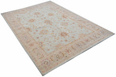 A rectangular Afghan Chobi rug featuring a traditional floral pattern in soft beige and peach tones.