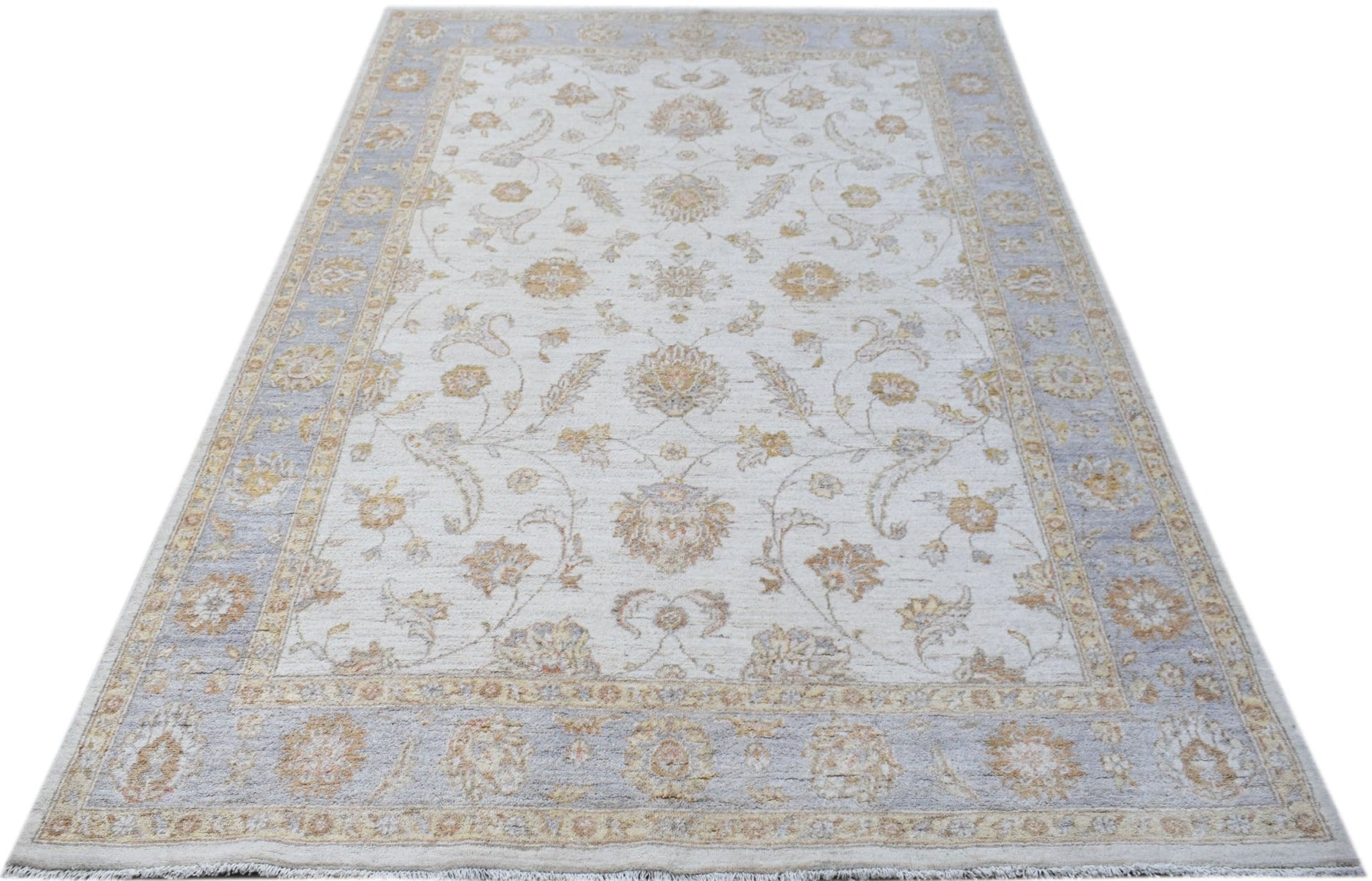 An Afghan Chobi rug featuring a traditional floral pattern in soft beige and blue tones.